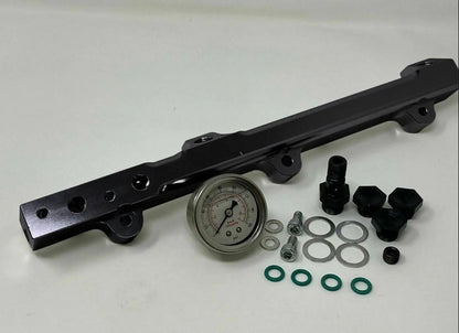 High flow fuel rail for Honda Prelude H22 H23 and Accord F22 engine, by Jack Spania Racing, with metallic finish and mounting ports.