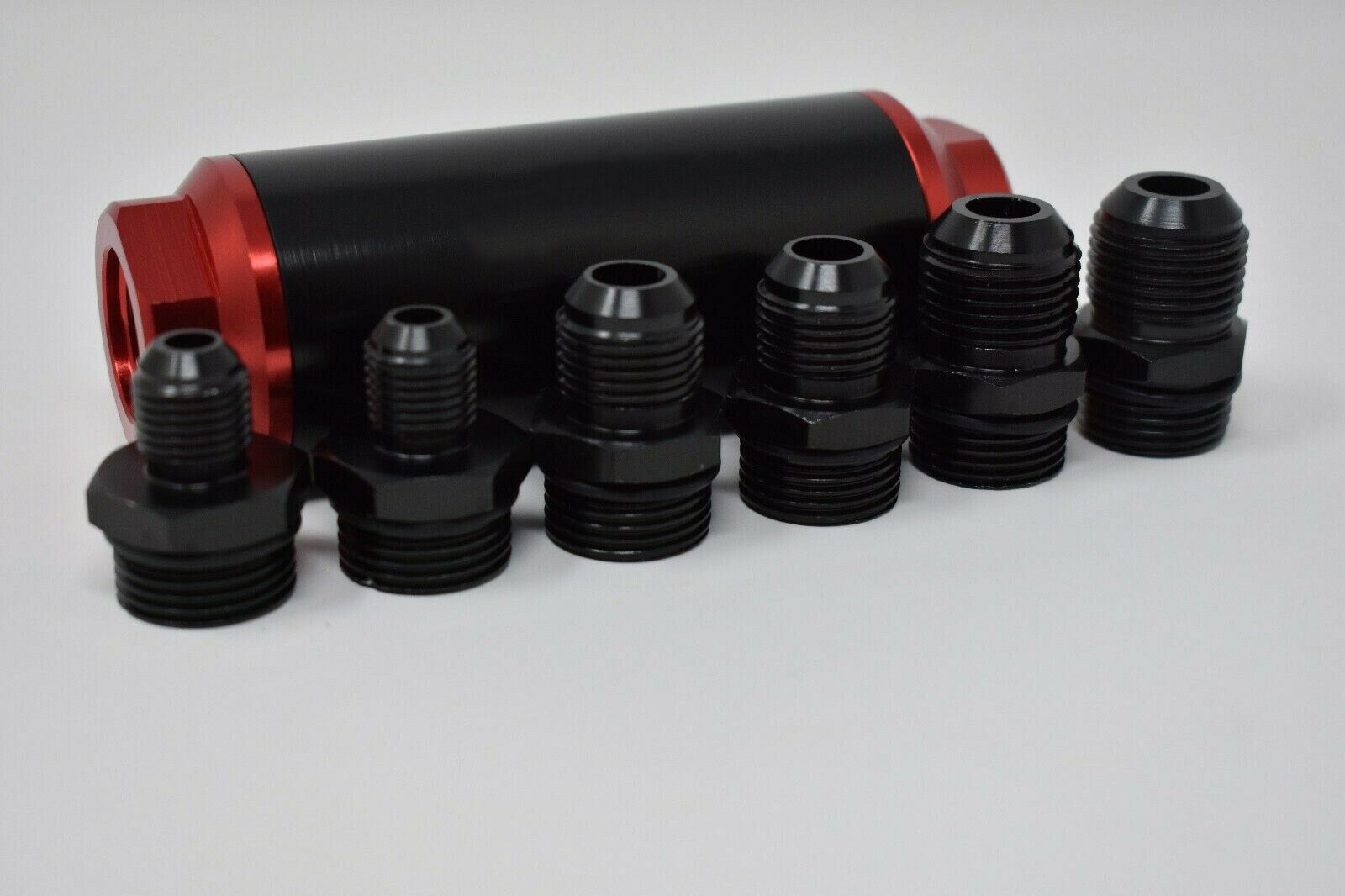Universal Jack Spania Racing inline fuel filter with AN 6, 8, 10 fittings and adapter, engine part for fuel system.