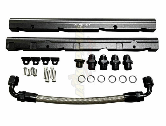 Jack Spania Racing billet LS fuel rail kit for GM LS3 V8 engine with AN8 fittings and OE intake manifold hardware.