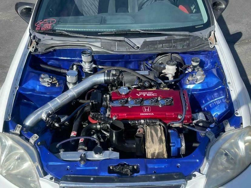 Jack Spania Racing D Series AC Line Tuck Kit installed on Honda Civic Si and Acura Integra DC2 engine, showcasing engine parts and tubing.