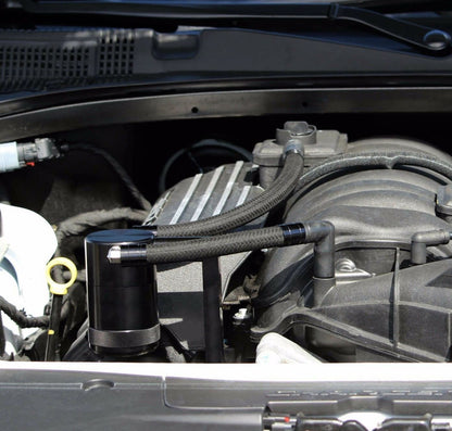 Jack Spania Racing catch can for Chrysler 300 Hemi, Charger, Challenger 5.7L-6.4L engine parts, image shows the black aluminum catch can.