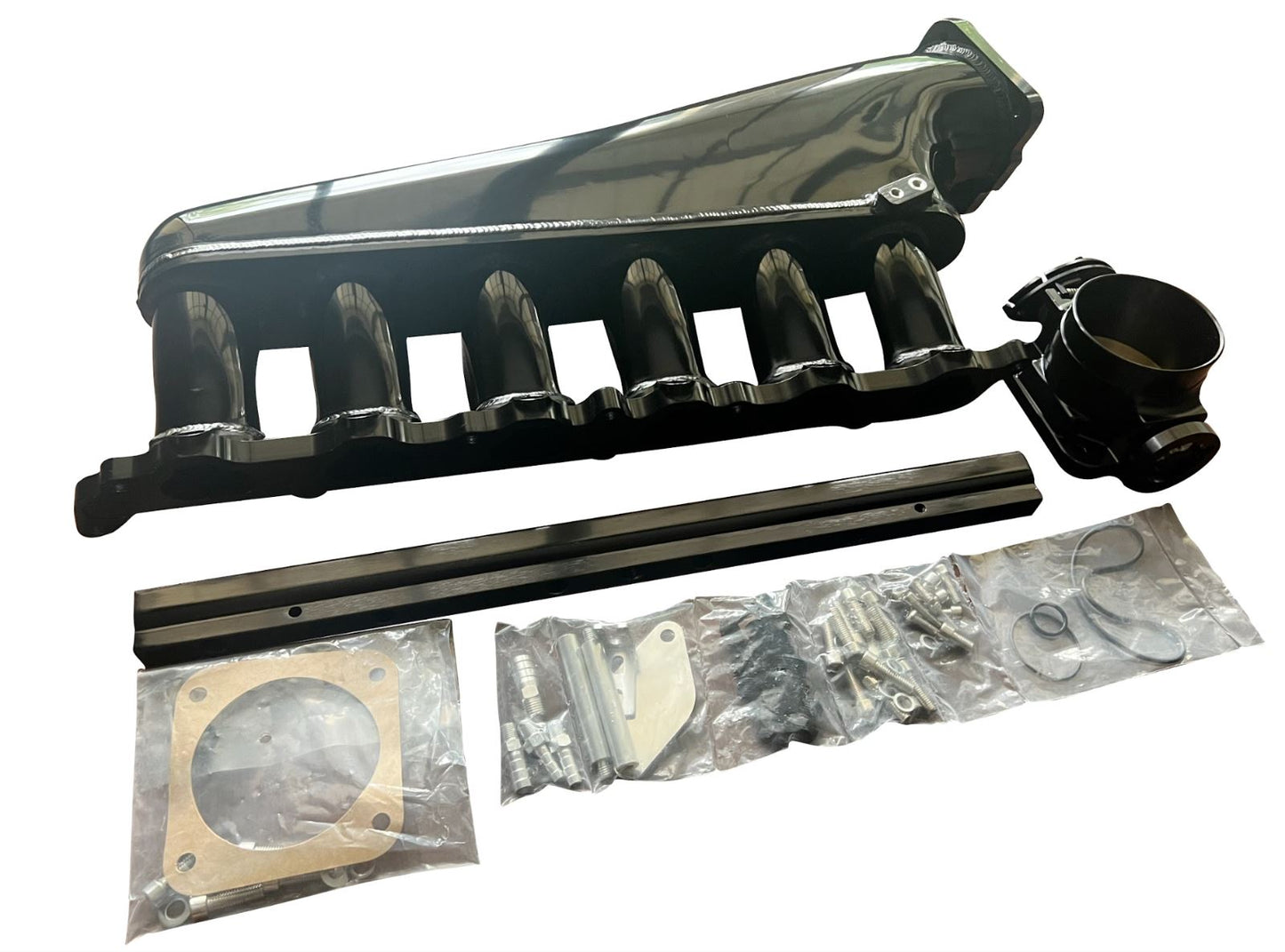 Jack Spania Racing 2JZ-GTE billet intake manifold with fuel rail and 90mm throttle body for Supra 2JZ engine swap.