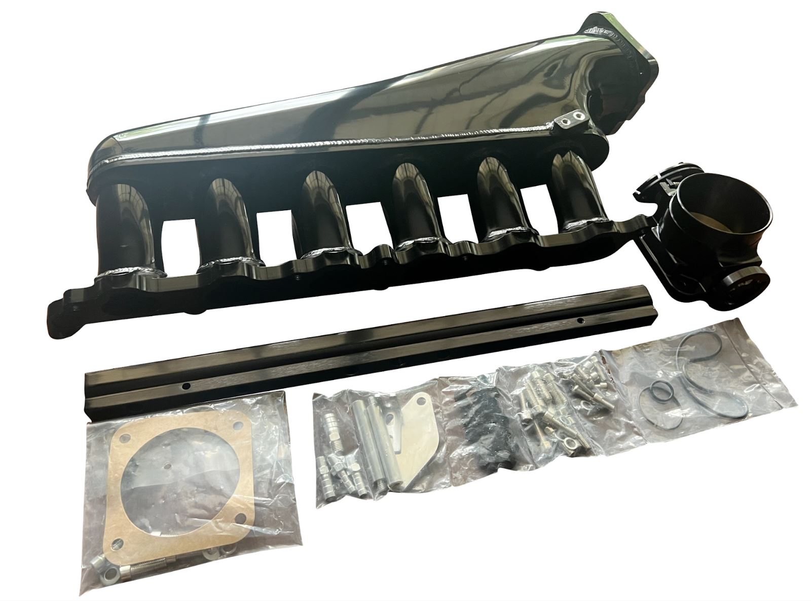 Jack Spania Racing 2JZ-GTE billet intake manifold with fuel rail and 90mm throttle body for Supra 2JZ engine swap.