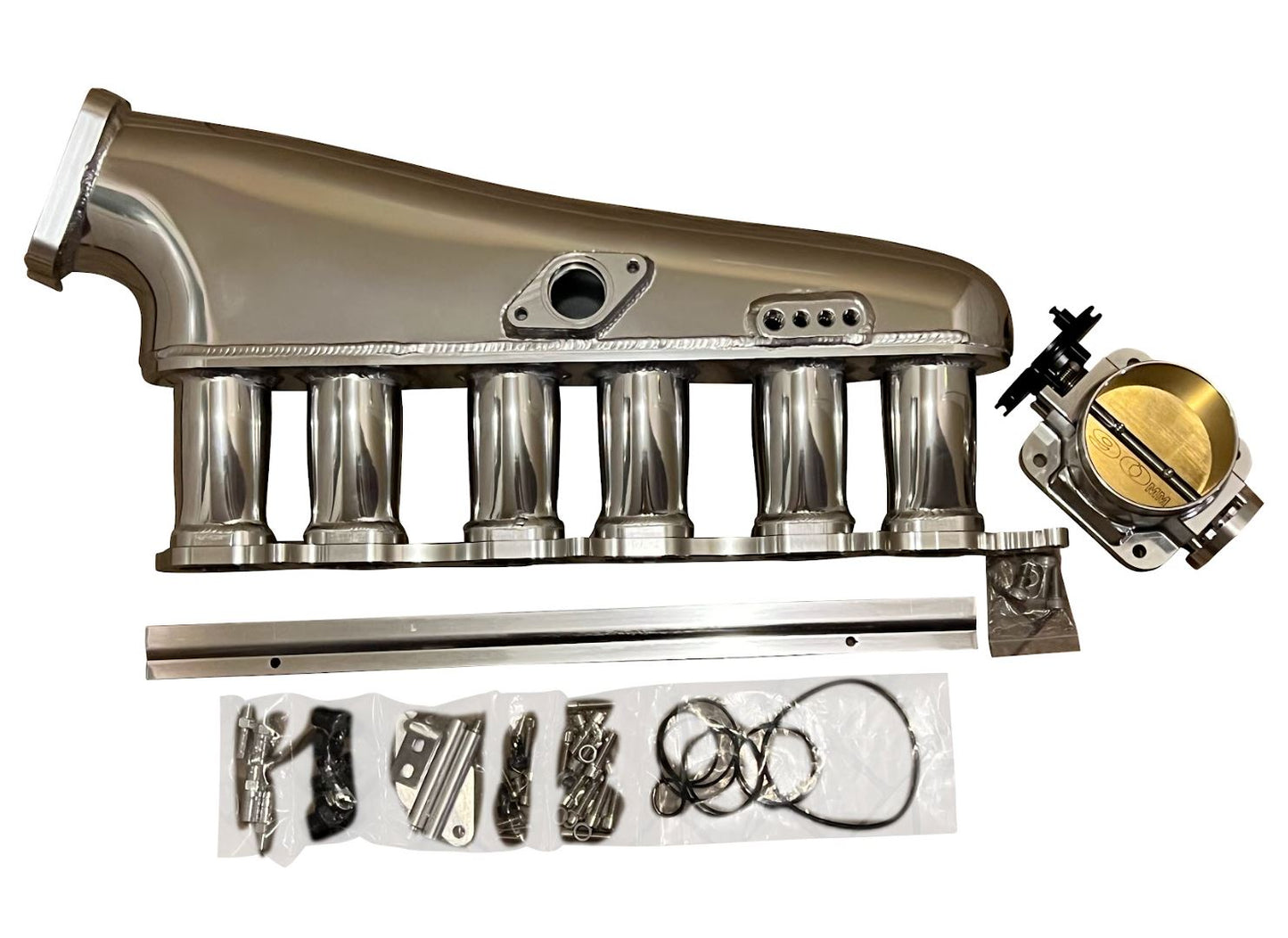 Jack Spania Racing 2JZ-GTE billet intake manifold, fuel rail, and 90mm throttle body for Supra 2JZ engine swap.