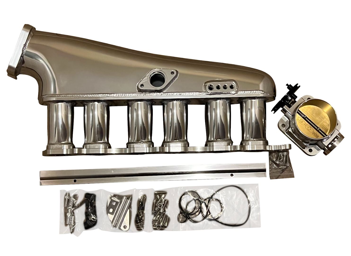 Jack Spania Racing 2JZ-GTE billet intake manifold, fuel rail, and 90mm throttle body for Supra 2JZ engine swap.