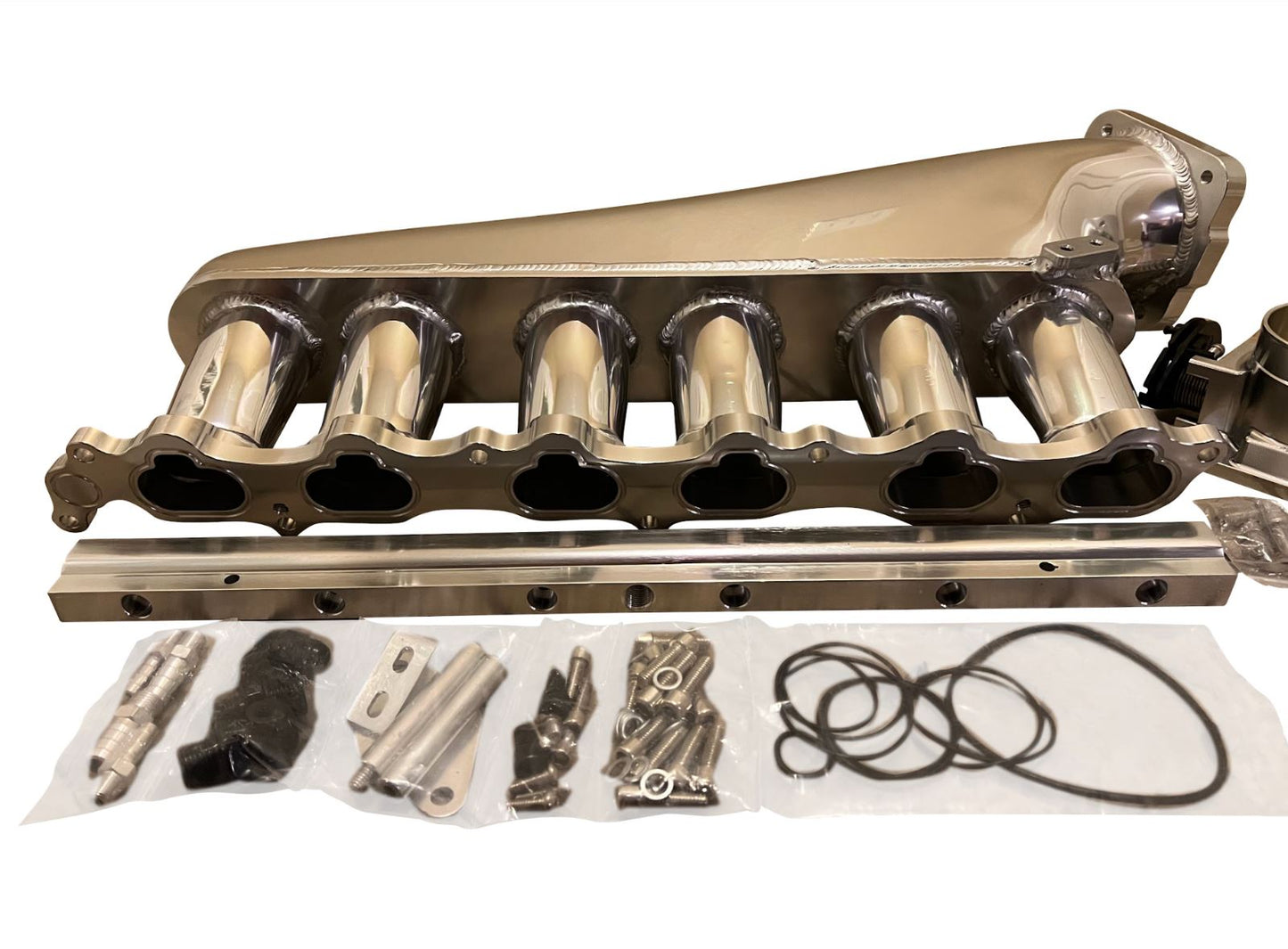 Jack Spania Racing 2JZ-GTE billet intake manifold, fuel rail, and 90mm throttle body for Supra 2J swap engine parts.