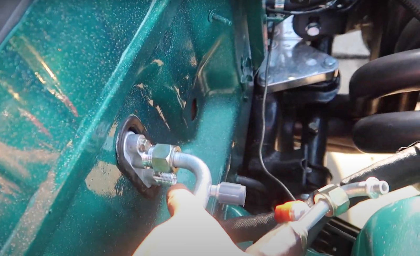Jack Spania Racing B Series AC Line Tuck Kit with condenser installed in a Honda Civic Si or Acura Integra DC2 engine bay