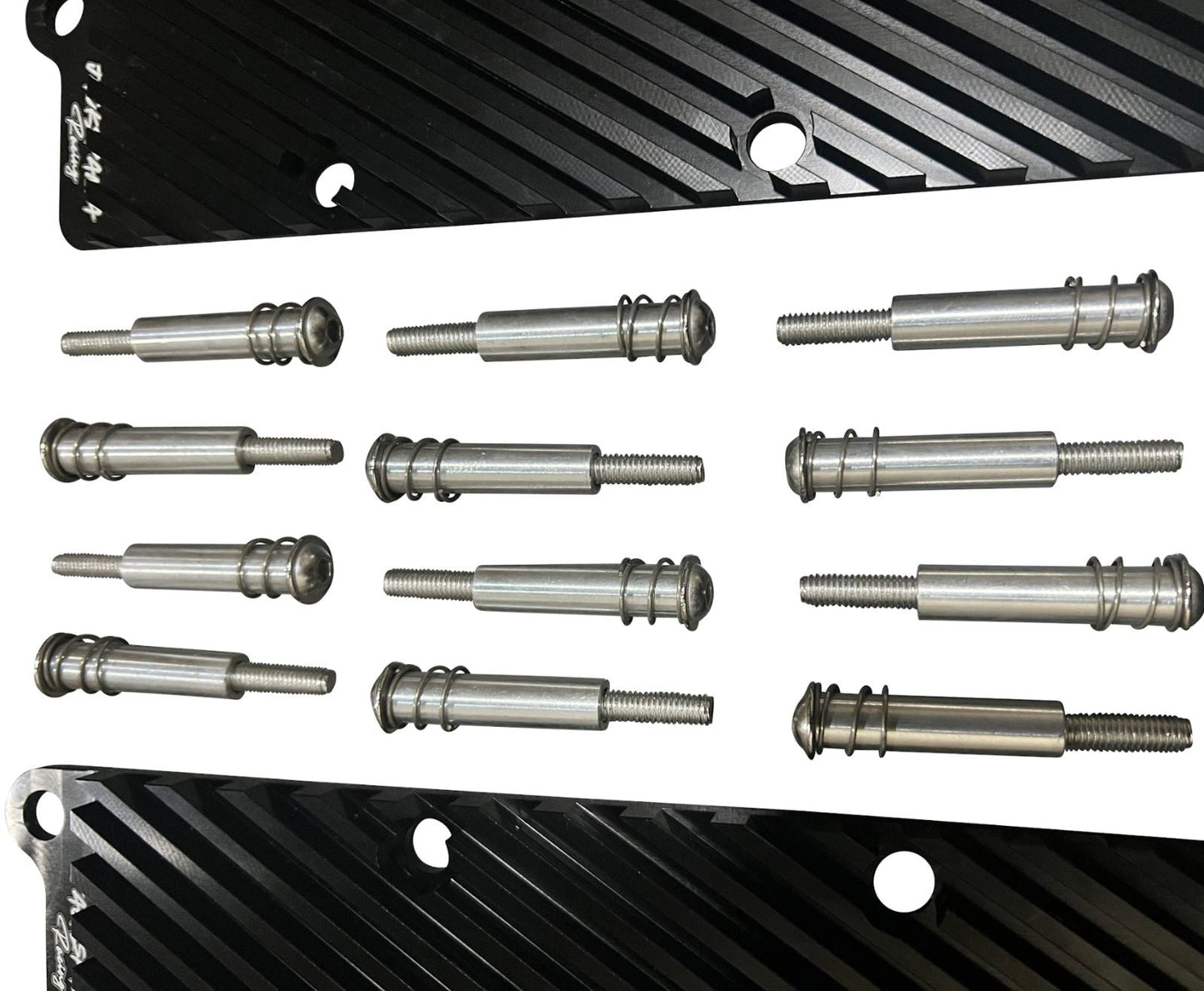 Jack Spania Racing 2.7T Conversion Coil Pack Hold Down Bracket Kit for Audi engine parts, showing metal brackets and mounting hardware.