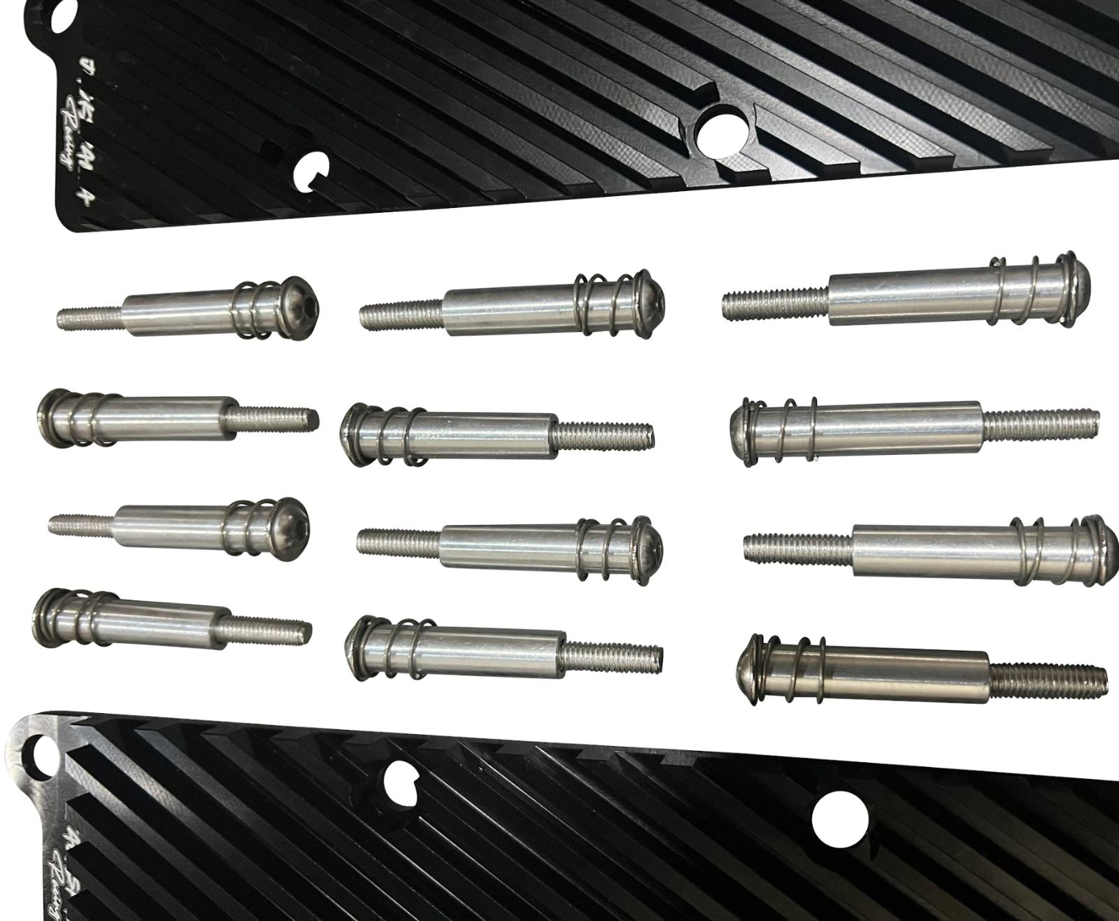 Jack Spania Racing 2.7T Conversion Coil Pack Hold Down Bracket Kit for Audi engine parts, showing metal brackets and mounting hardware.
