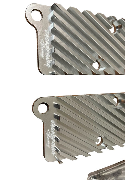 Jack Spania Racing 2.7T conversion coil pack hold-down bracket kit for Audi engine parts, shown mounted on engine.