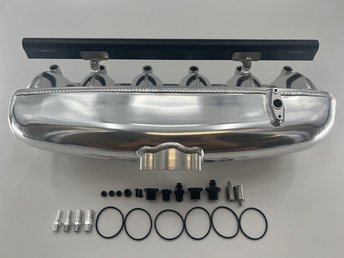 Center feed intake manifold fuel rail for BMW N54 engine, compatible with 135i, 335i, 535i E90, by Jack Spania Racing.