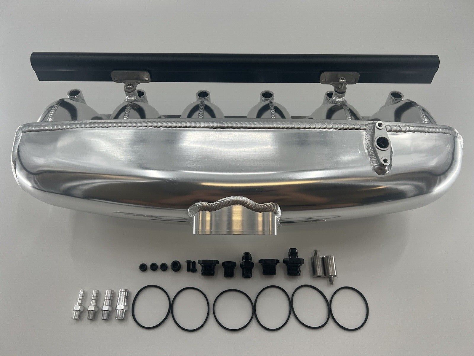 Center feed intake manifold fuel rail for BMW N54 engine, compatible with 135i, 335i, 535i E90, by Jack Spania Racing.
