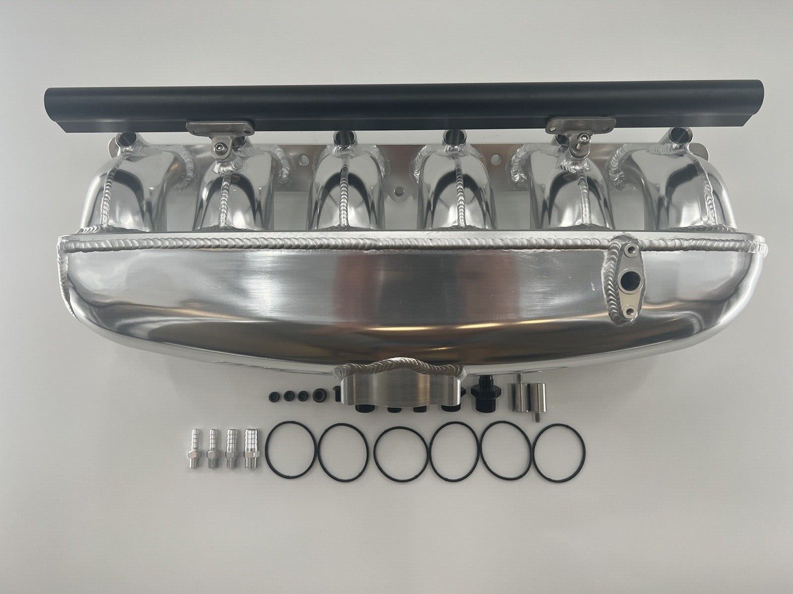 Center feed intake manifold fuel rail for BMW N54 engine, compatible with 135i, 335i, 535i E90 by Jack Spania Racing.