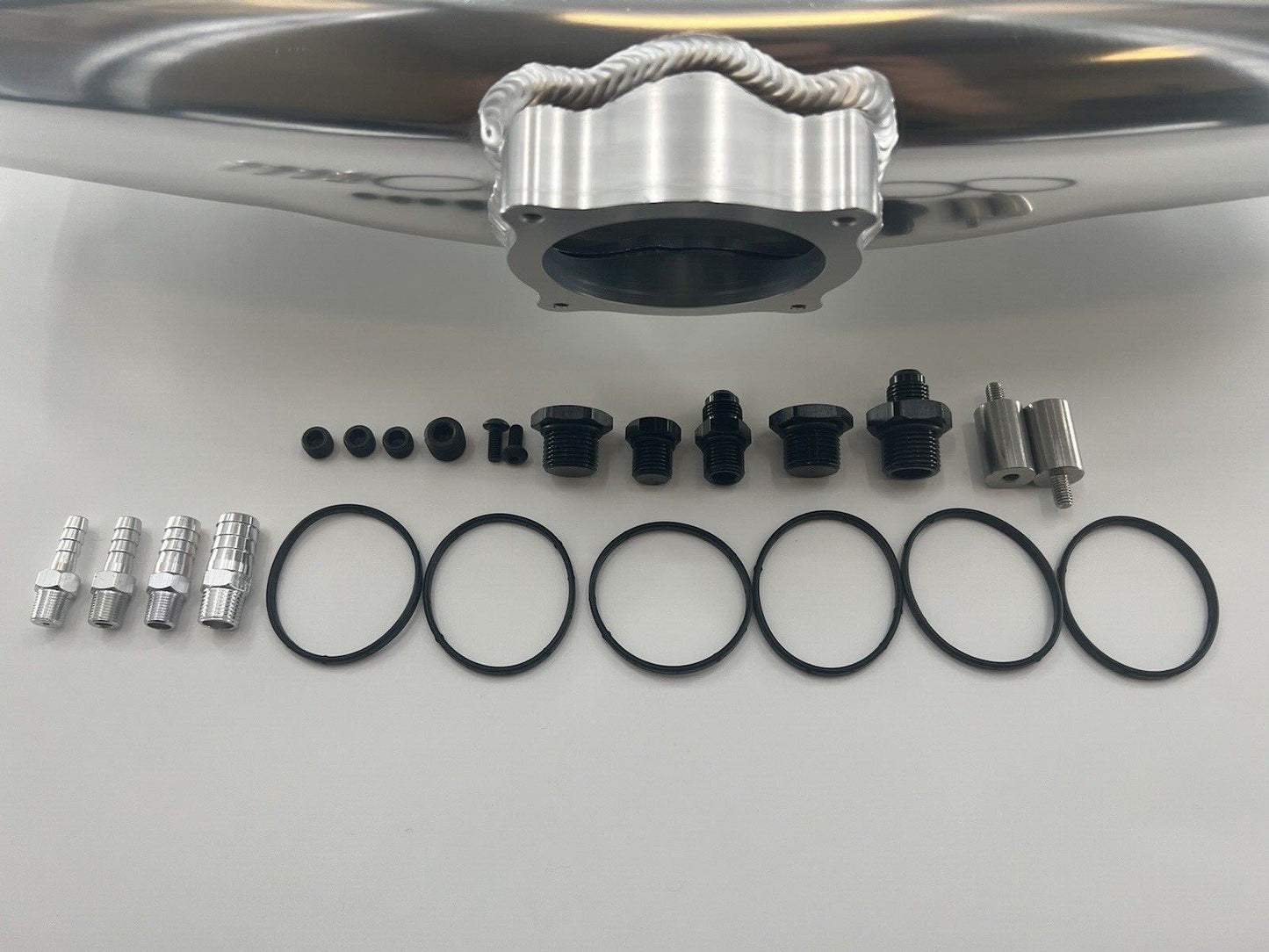 Center feed intake manifold fuel rail for BMW N54 135i 335i 535i E90 engine, by Jack Spania Racing, showing metal components.