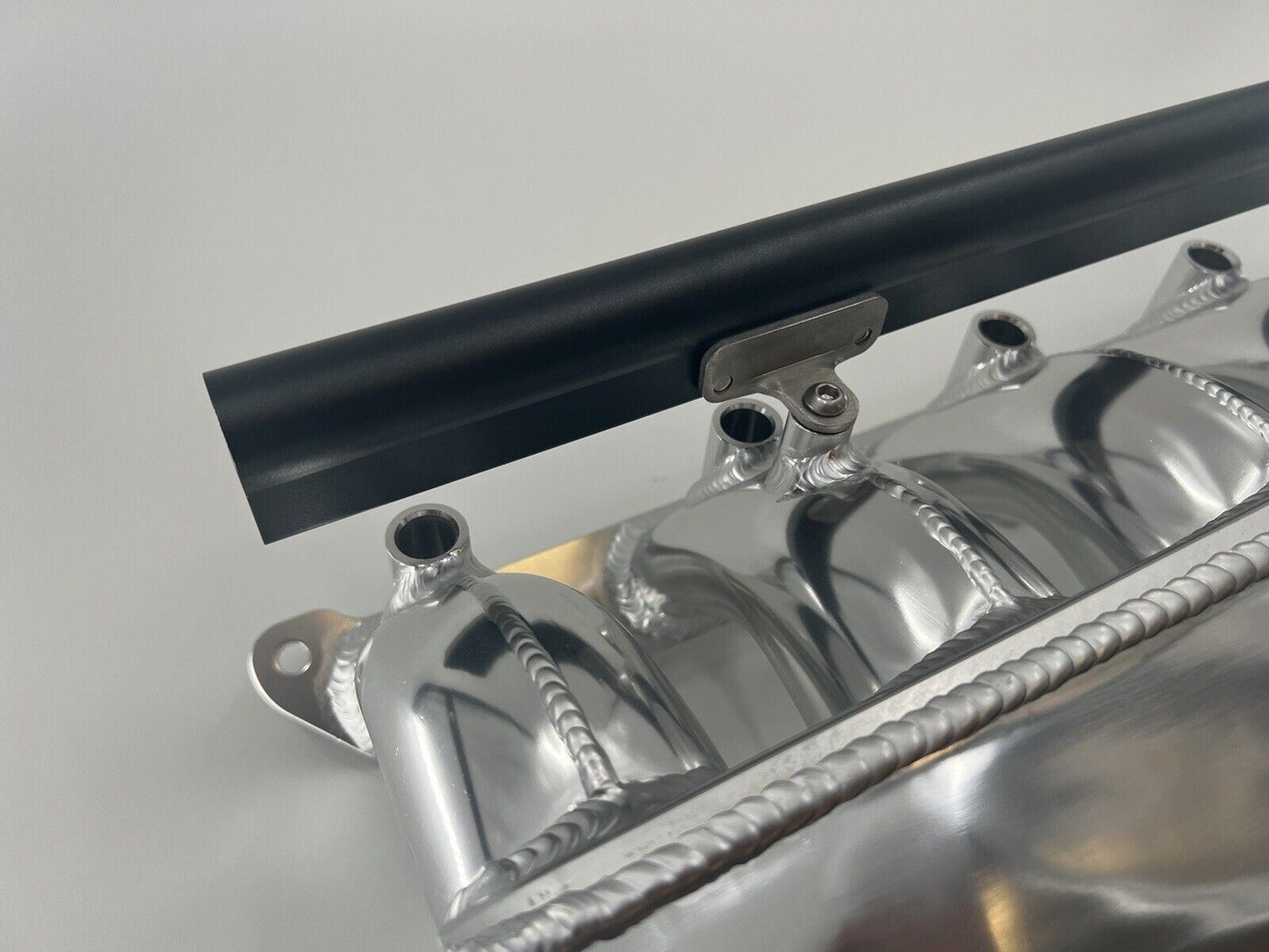 Center feed intake manifold fuel rail for BMW N54 135i, 335i, 535i engine, compatible with E90 models, by Jack Spania Racing.