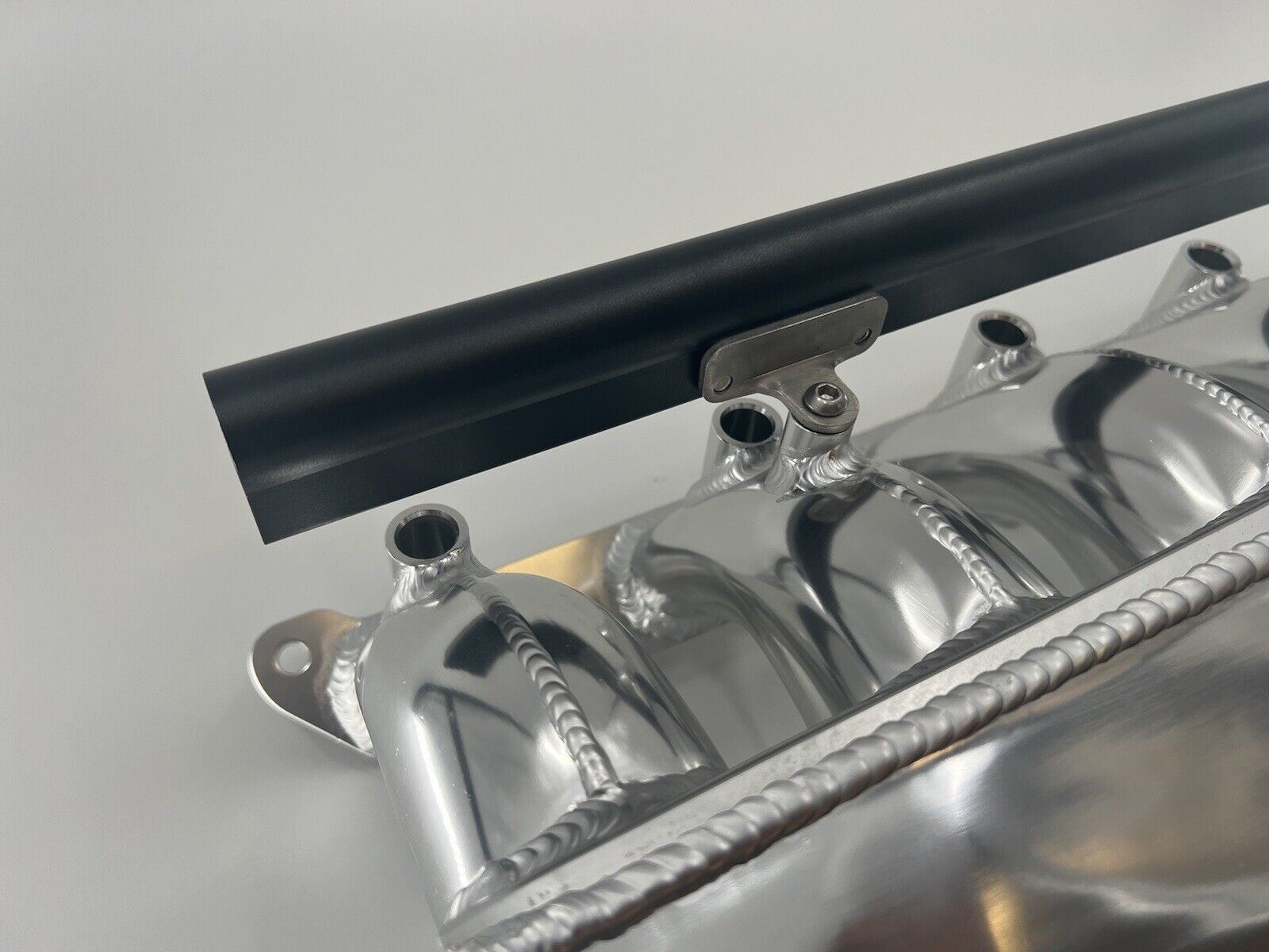 Center feed intake manifold fuel rail for BMW N54 135i, 335i, 535i engine, compatible with E90 models, by Jack Spania Racing.