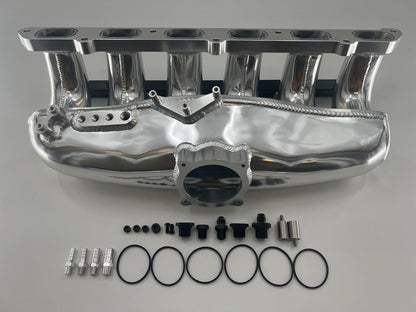 Center feed intake manifold fuel rail for BMW N54 135i, 335i, 535i E90 engine, by Jack Spania Racing, with visible metal components.