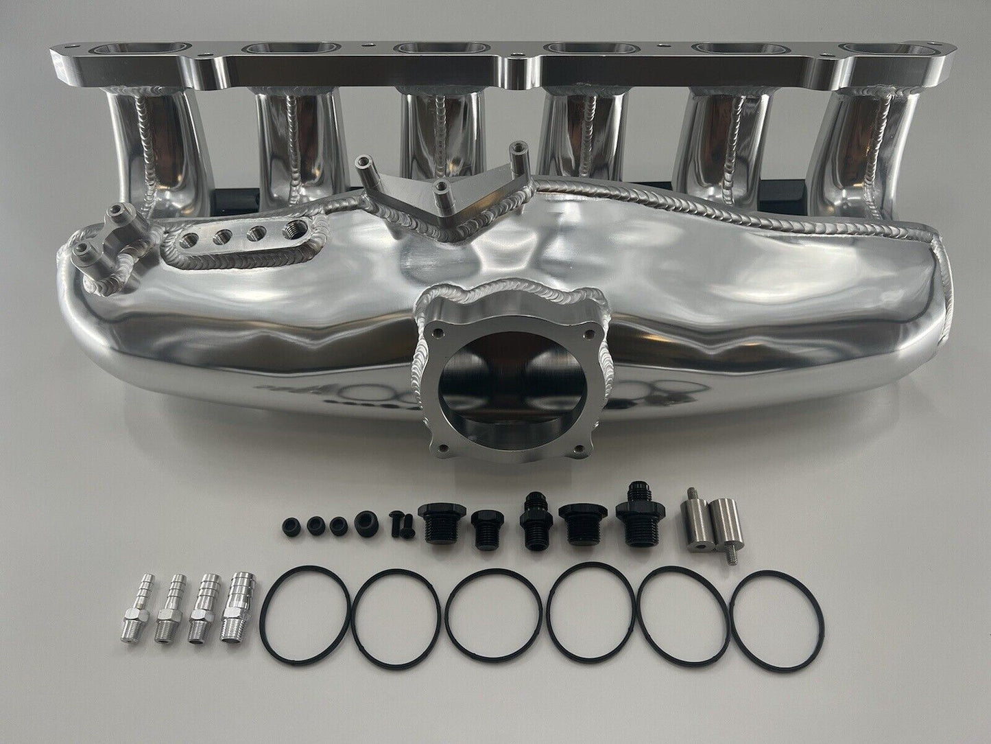 Center feed intake manifold fuel rail for BMW N54 engines, compatible with 135i, 335i, and 535i E90 models, by Jack Spania Racing.