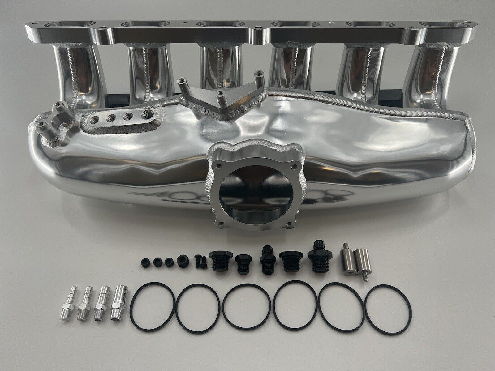 Center feed intake manifold fuel rail for BMW N54 engines, compatible with 135i, 335i, and 535i E90 models, by Jack Spania Racing.
