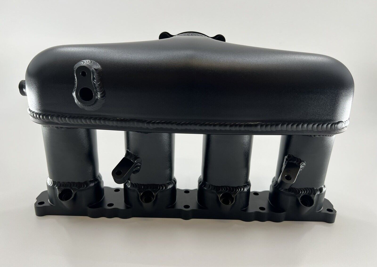 Intake manifold for VW Audi 1.8T and 2.0T engines, EA888 Gen 3, by Jack Spania Racing, shown on engine part.