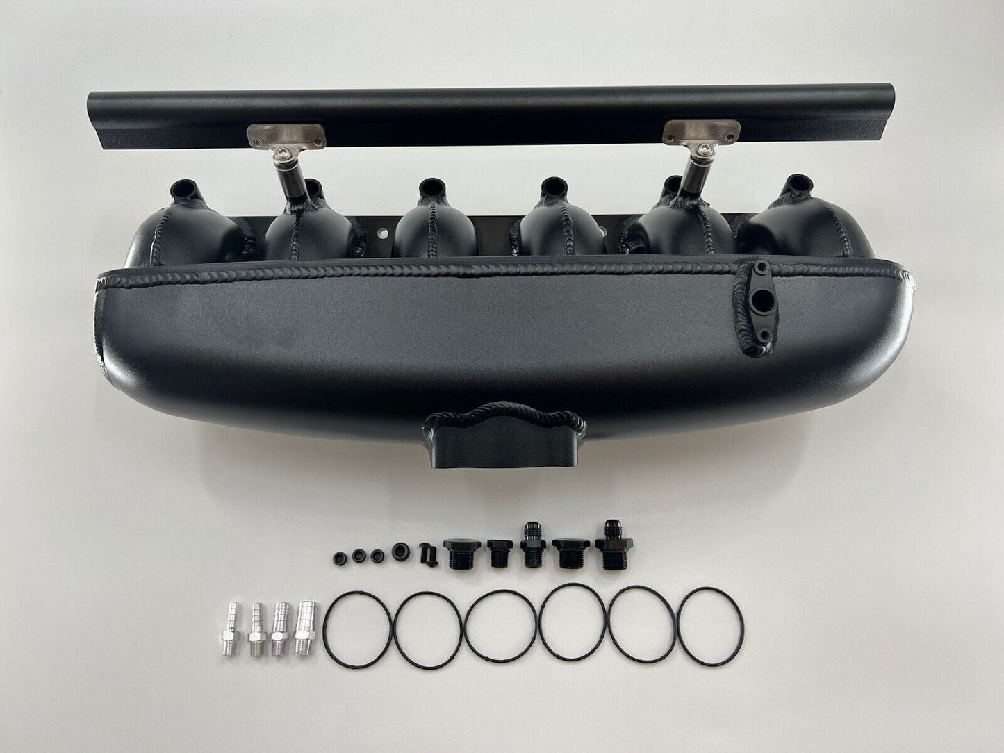 Center feed intake manifold fuel rail for BMW N54 135i, 335i, 535i engine parts by Jack Spania Racing, shown in image.