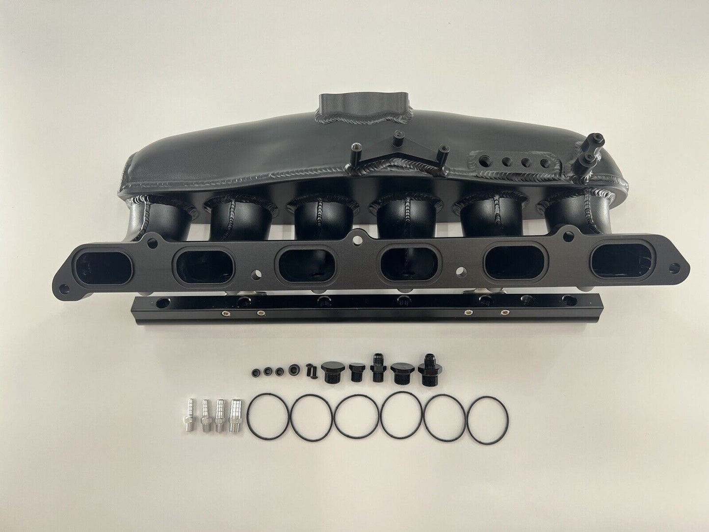 Center feed intake manifold fuel rail for BMW N54 engine, compatible with 135i, 335i, and 535i E90 models by Jack Spania Racing.