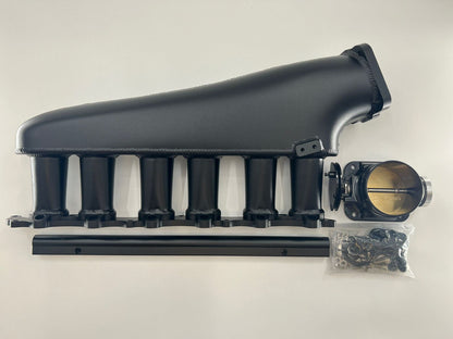 Jack Spania Racing 1JZ GTE billet intake manifold with fuel rail and 90mm throttle body for engine performance.