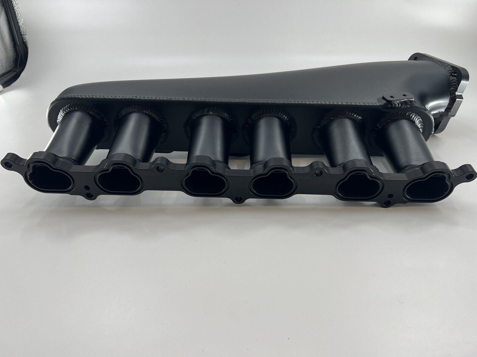 Jack Spania Racing 1JZ GTE billet intake manifold with fuel rail and 90mm throttle body for engine performance.