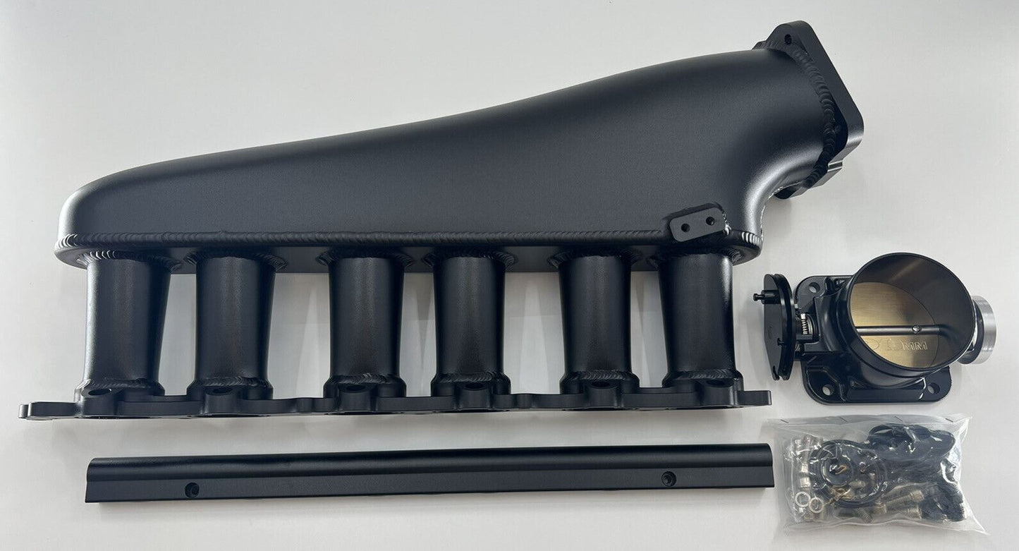 Jack Spania Racing 1JZ GTE billet intake manifold with fuel rail and 90mm throttle body for engine performance.