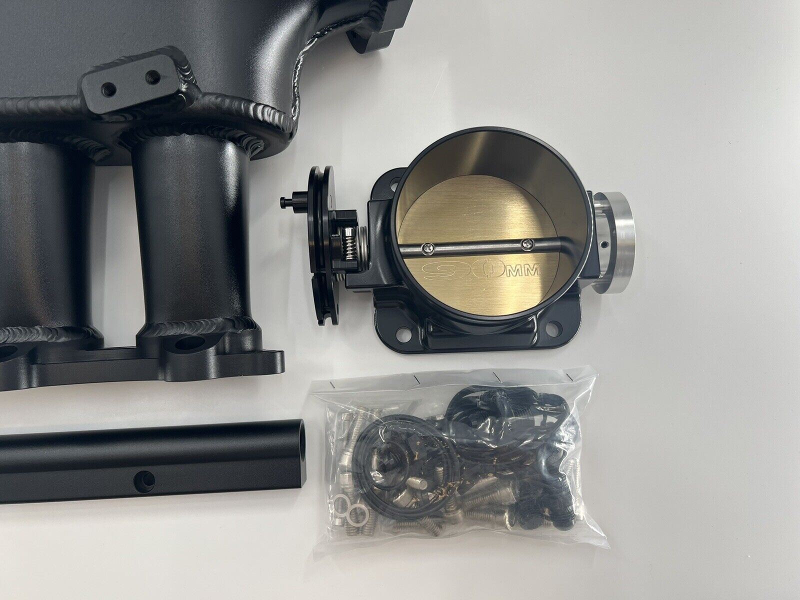 Jack Spania Racing 1JZ GTE billet intake manifold with fuel rail and 90mm throttle body for engine performance.