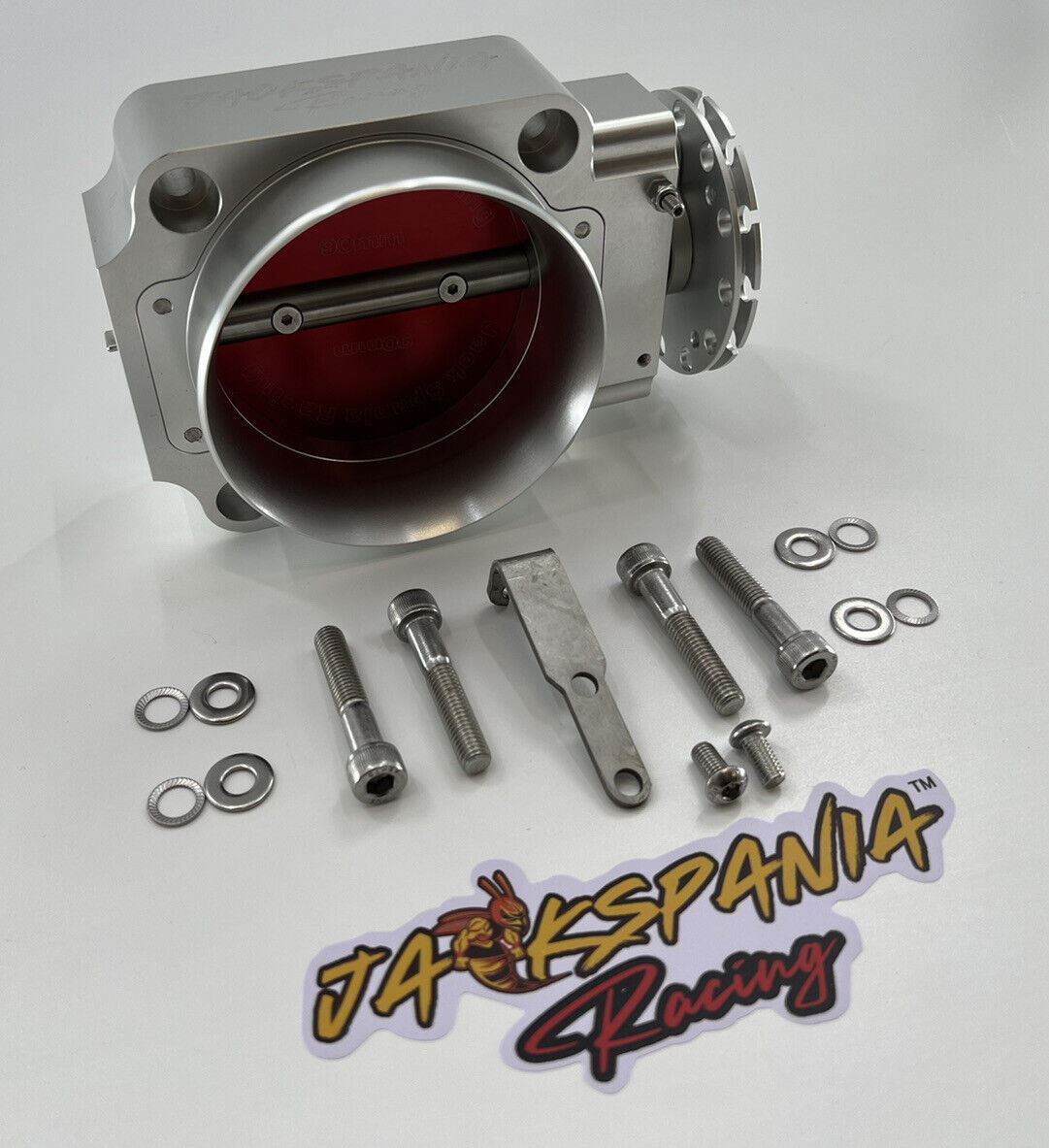 Jack Spania Racing 90mm throttle body with 4-inch hose coupling adapter installed on engine inlet for performance tuning.