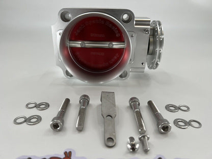 Jack Spania Racing 90mm throttle body with 4-inch hose coupling adapter for engine intake systems.