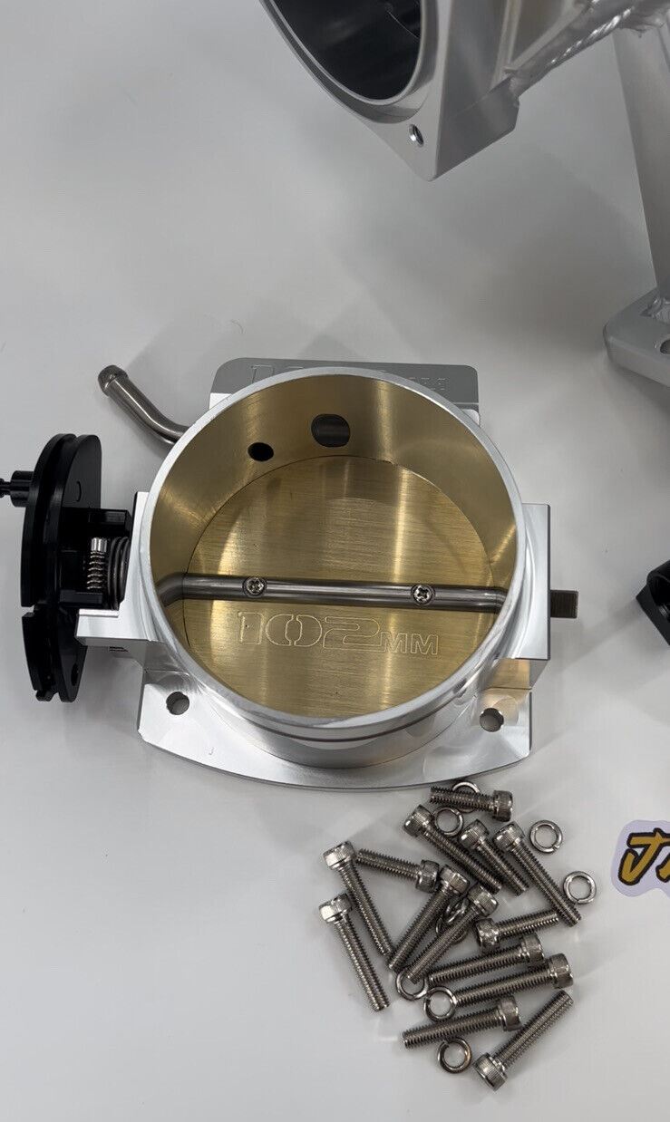 GM Chevrolet LS fabricated intake manifold and throttle body for LS3 L92 engines, by Jack Spania Racing, showing polished engine parts.