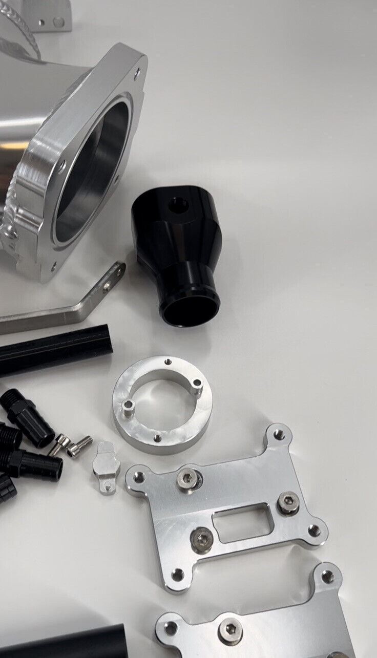 Jack Spania Racing RB25DET intake manifold fuel rail and 90mm Skyline throttle body for engine performance and tuning.