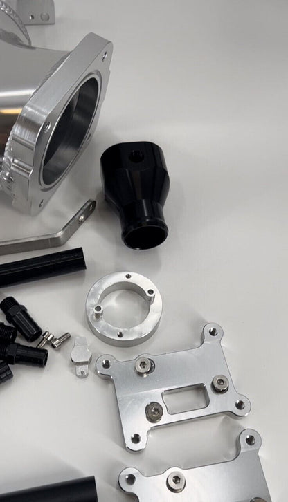 Jack Spania Racing RB25DET intake manifold fuel rail and 90mm Skyline throttle body for engine performance and tuning.