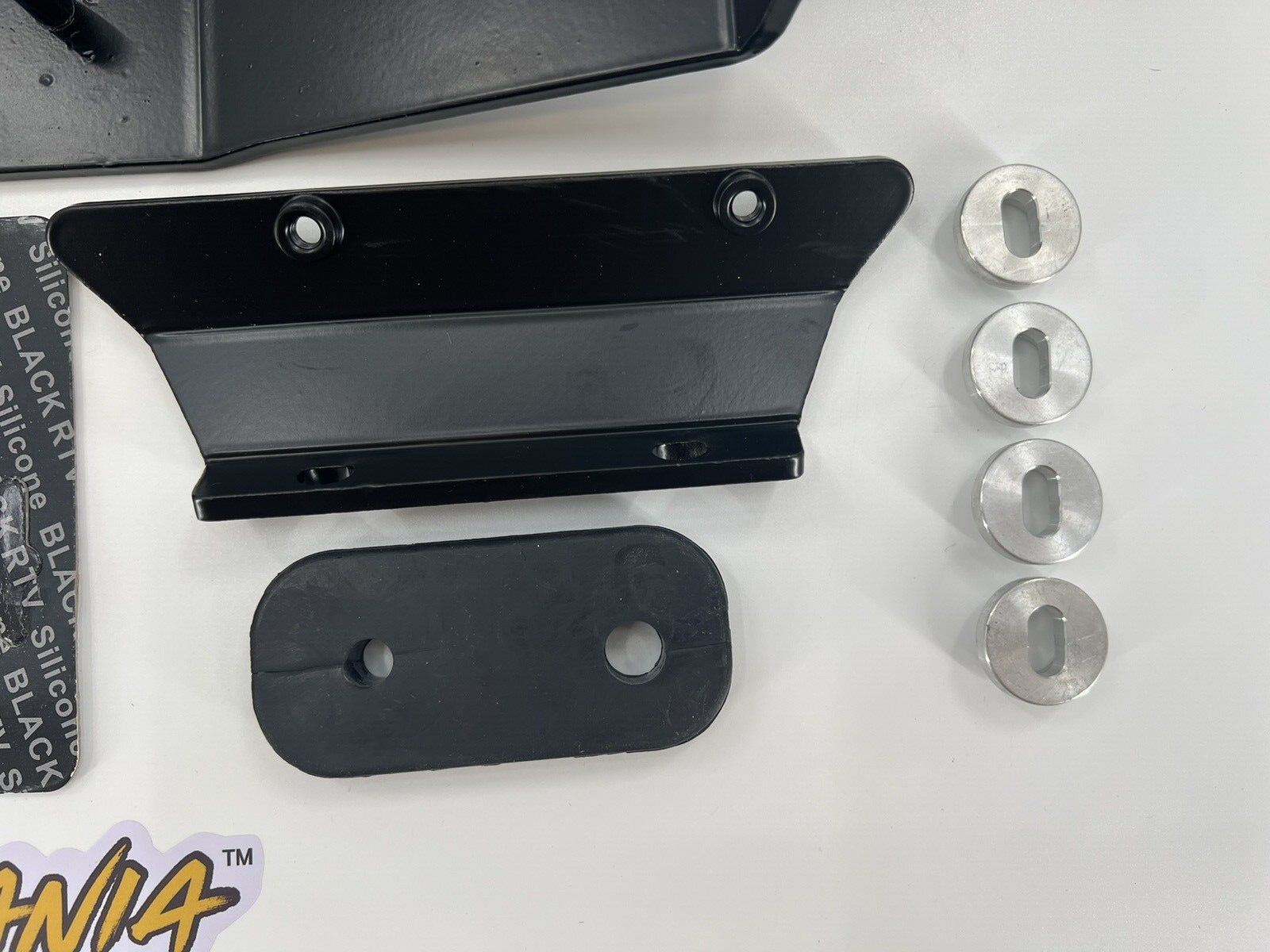 Jack Spania Racing RSX mounting kit for Honda Acura K Swap transmission, shown on a transmission part in the image.
