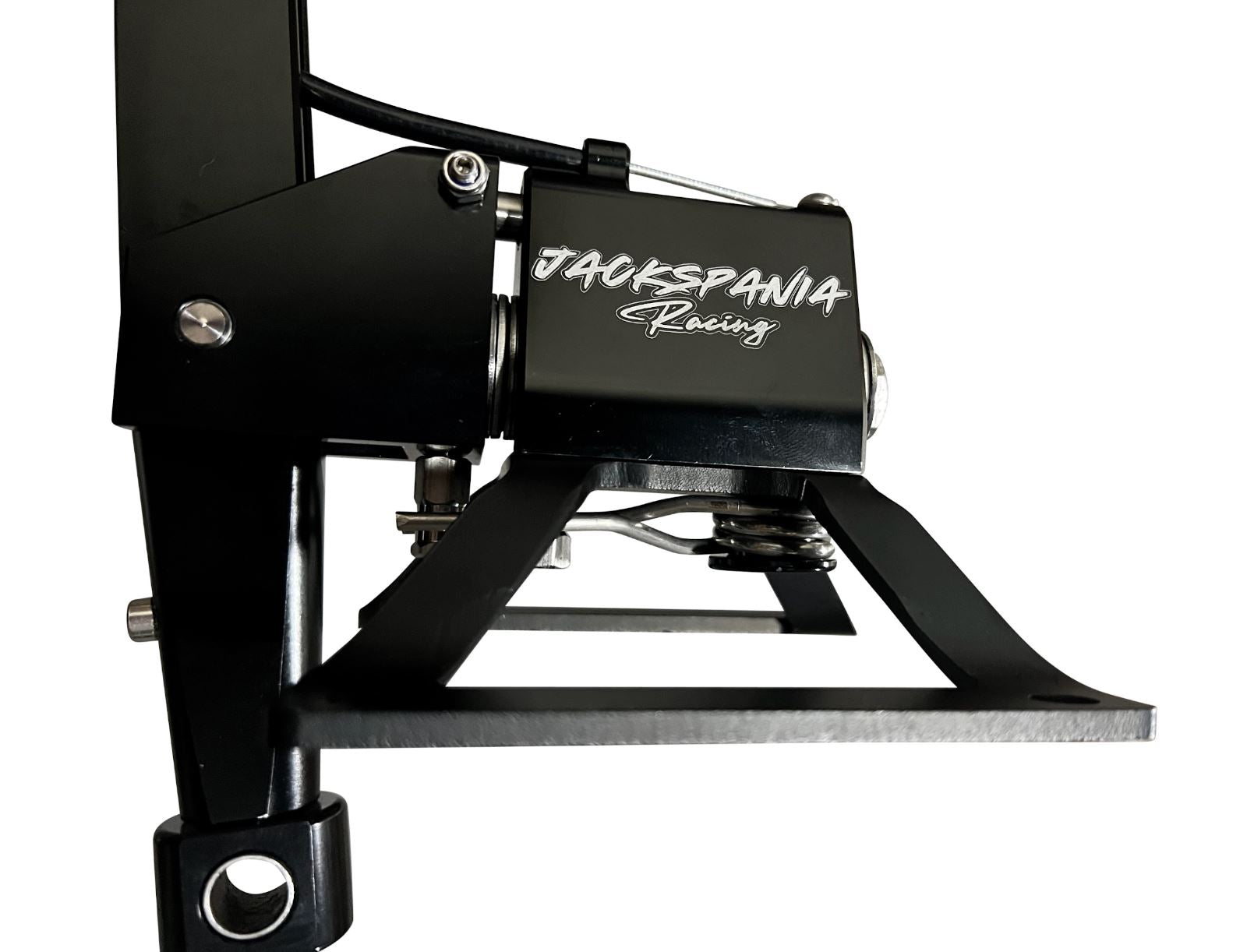 Self-centering short shifter box for BMW E30 to F87 models by Jack Spania Racing, showing the compact transmission part in a workshop setting.
