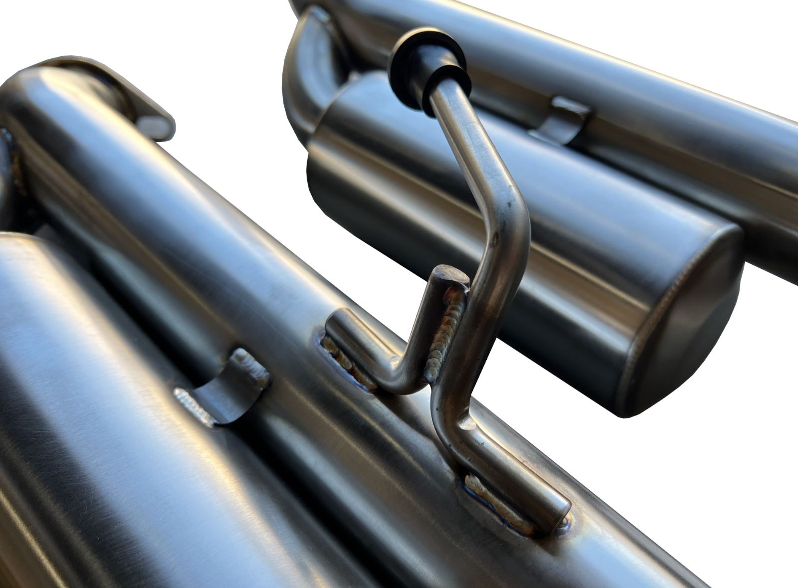 Jack Spania Racing Infiniti Q50 muffler axle back delete exhaust kit with 2.5-inch Helmholtz resonated pipes, front view showing polished metal.