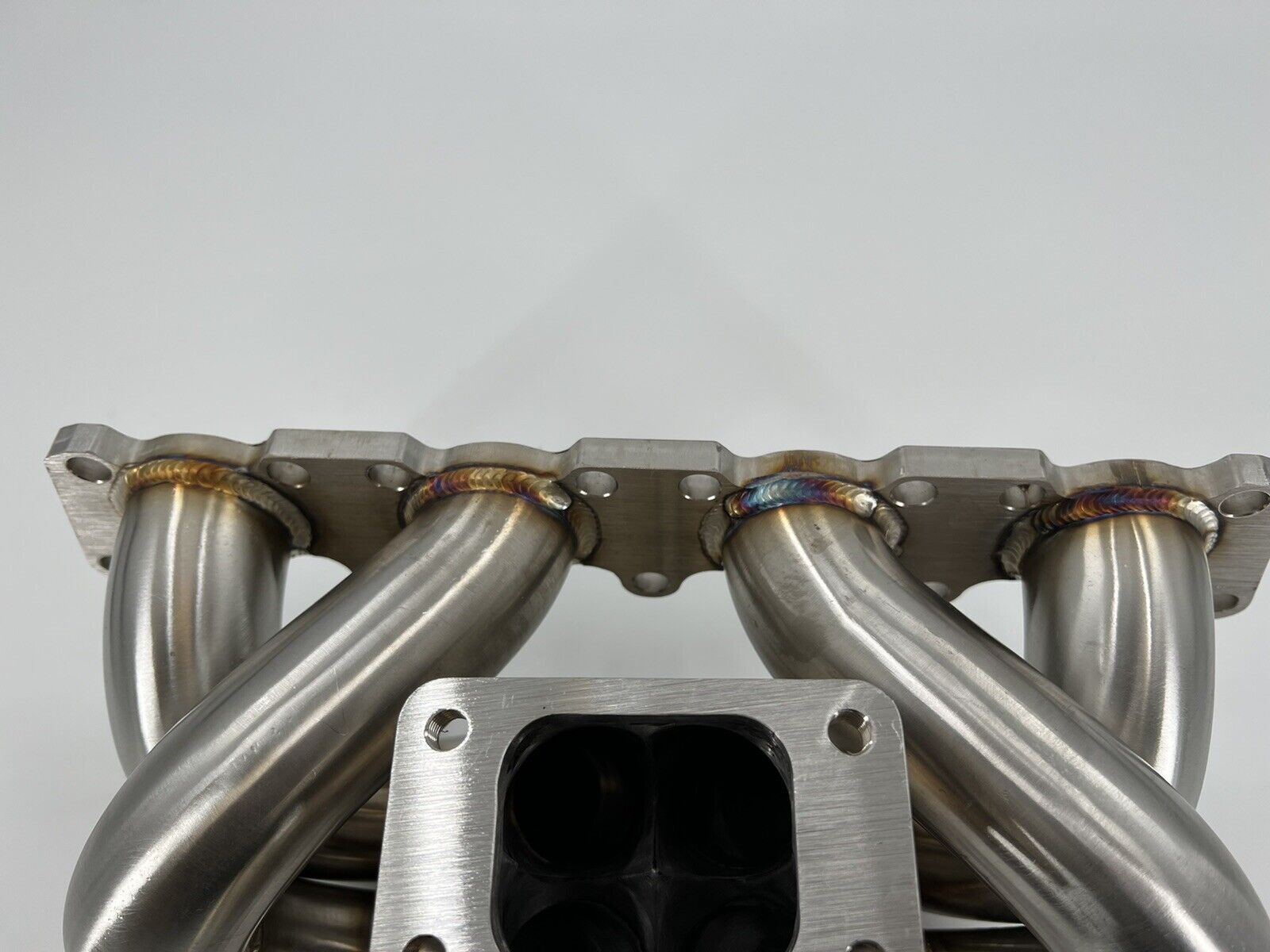 T3 turbo manifold for VW A4 1.8T Jetta Golf GTI GLI by Jack Spania Racing, 2-bolt exhaust part, metal construction with mounting flanges.