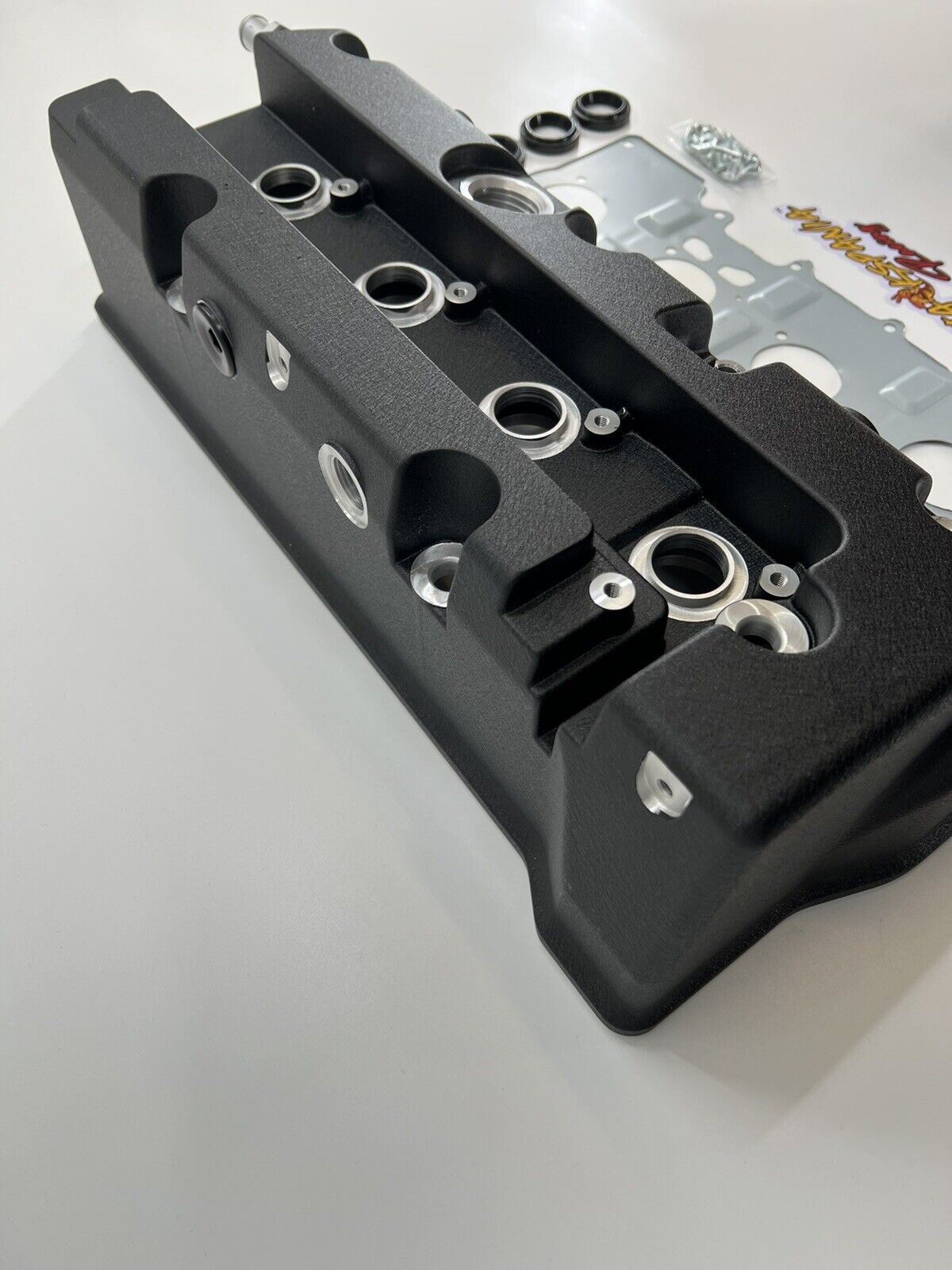 Cast aluminum K Series vented valve cover baffle for Honda Acura K20 K24 engines, designed for engine part installation.