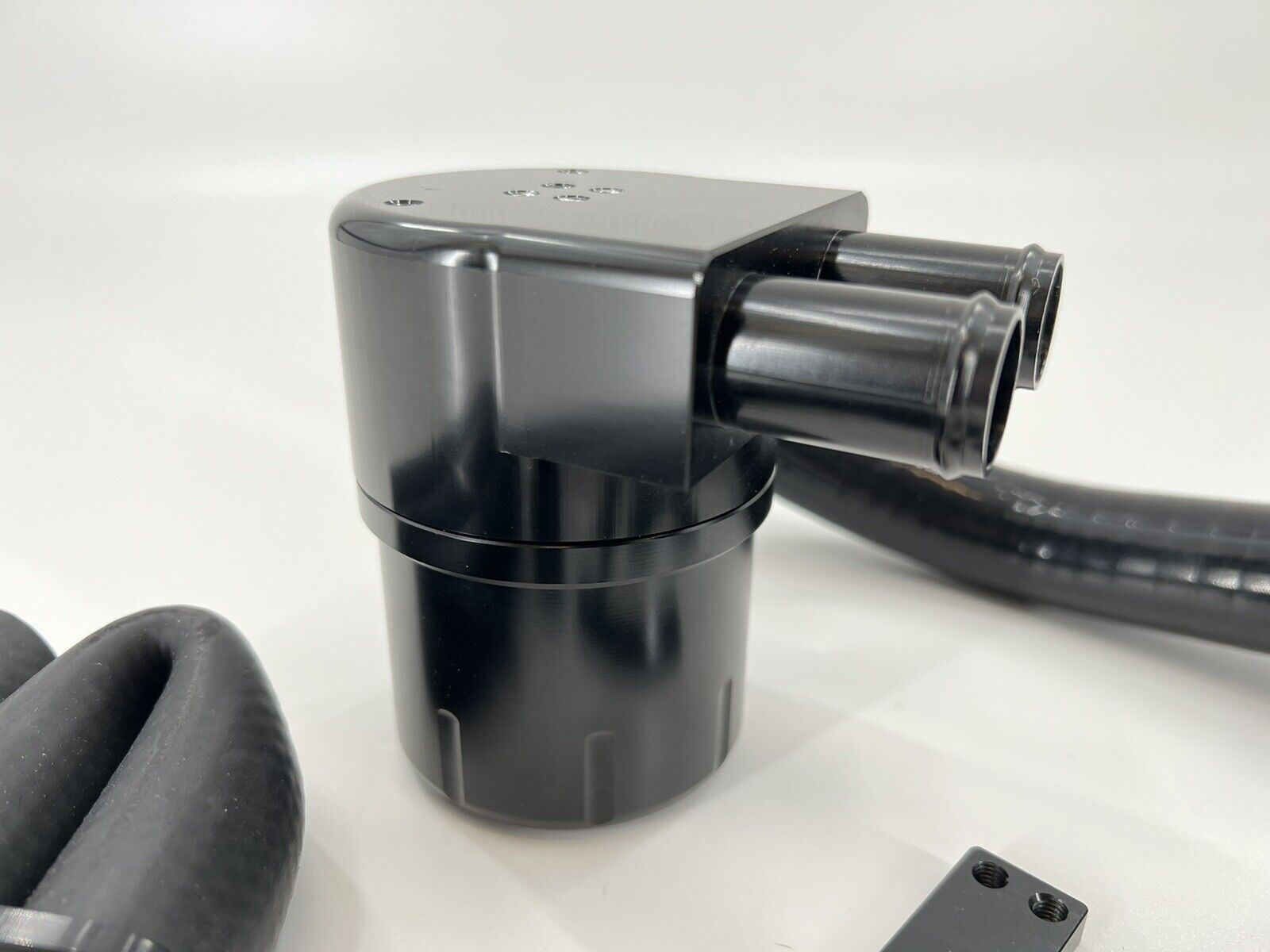 Jack Spania Racing billet catch can kit installed in a Volkswagen MK7 Golf Gti 2.0T engine, showing the engine bay with catch can components.