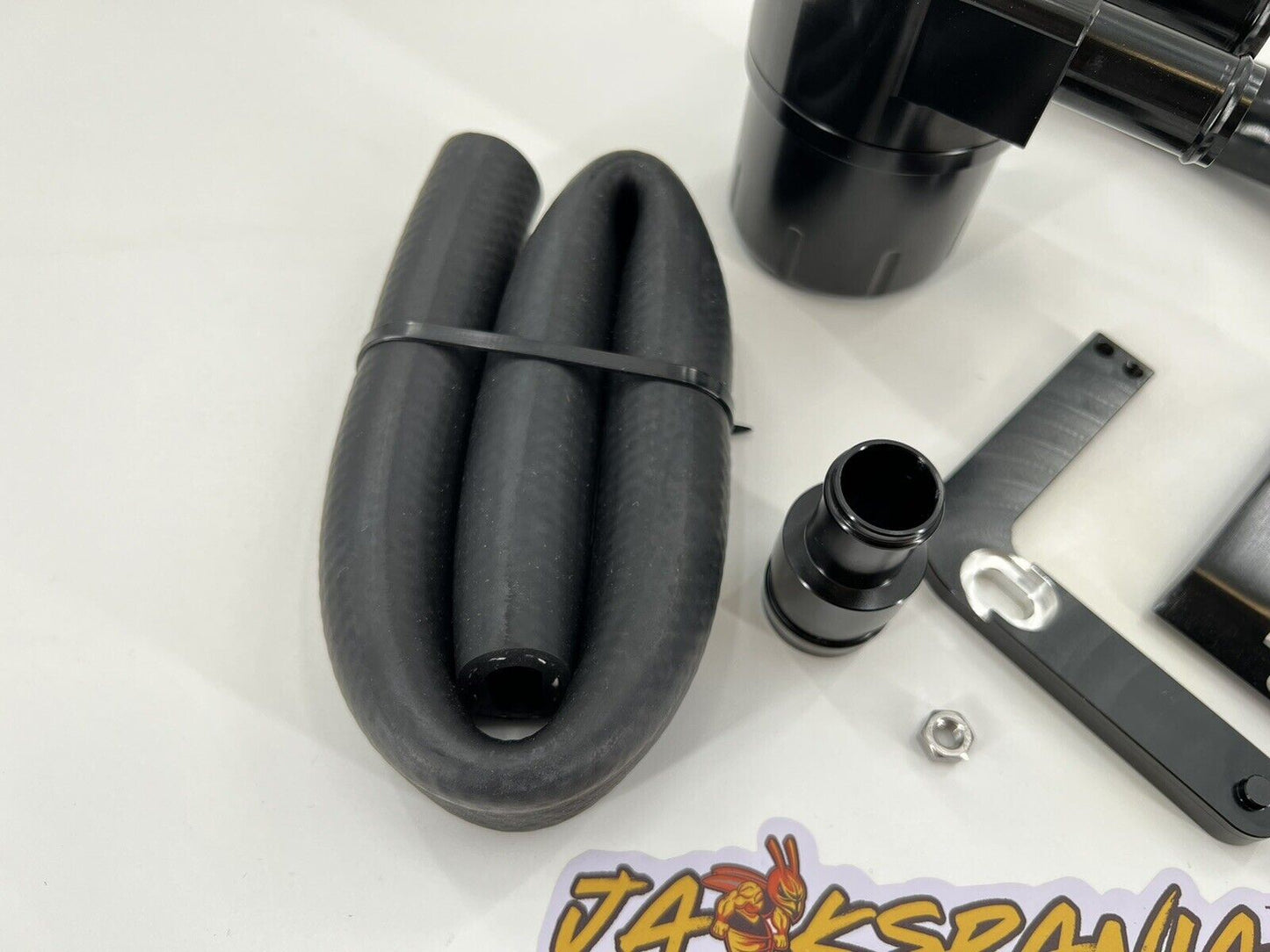 Billet catch can kit for Audi VW MK7 Golf Gti, A3, TT, S3 8V, and 1.8T engine, by Jack Spania Racing, installed on engine.