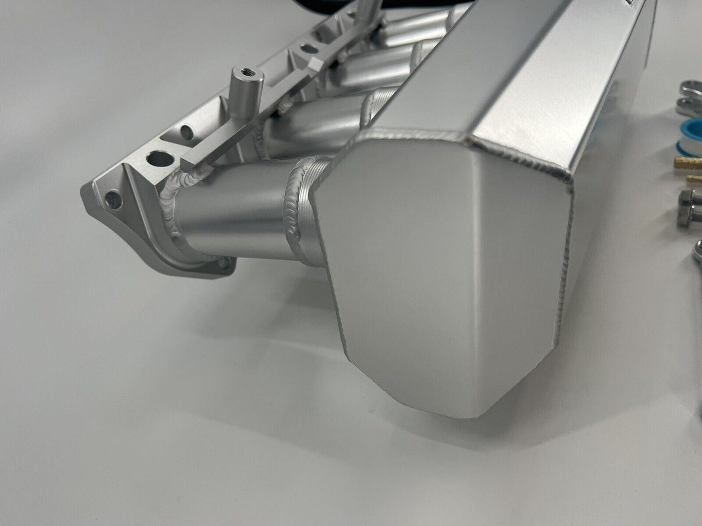 Jack Spania Racing 90mm Ultra Side Feed Intake Manifold for K Series K20 K24 engines on a car engine plenum.