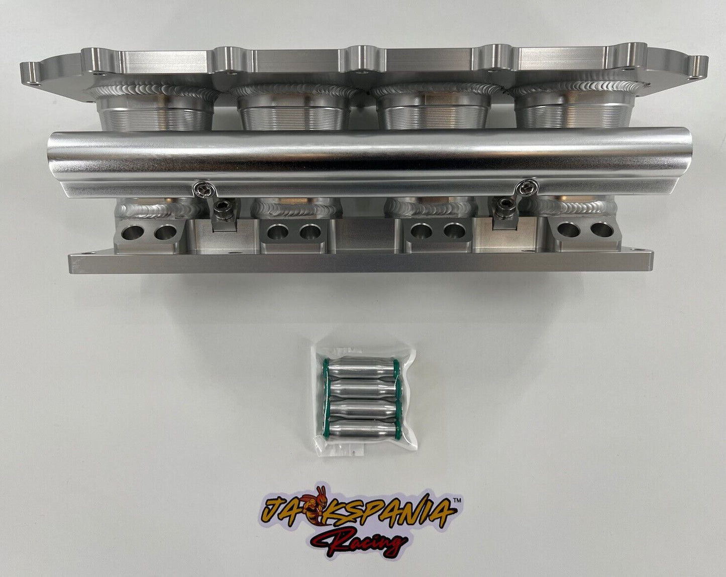 Jack Spania Racing billet K series intake manifold adapter for Skunk2 Ultra engine parts, showing the precision-machined metal component.