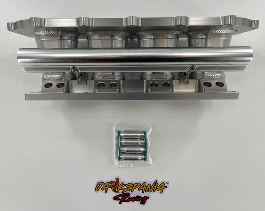 Jack Spania Racing billet K series intake manifold adapter for Skunk2 Ultra engine parts, showing the precision-machined metal component.