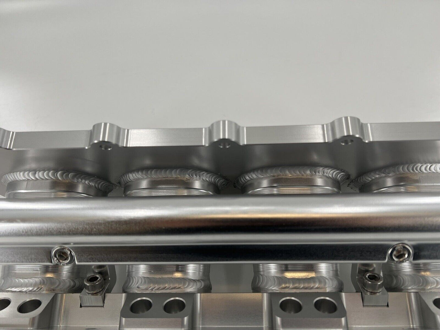 Jack Spania Racing billet K Series intake manifold adapter for Skunk2 Ultra engine parts, shown installed on engine.