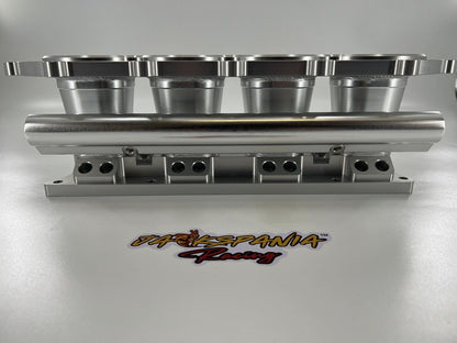Jack Spania Racing billet K Series intake manifold adapter for Skunk2 Ultra engine parts, showing the precision-machined metal component.