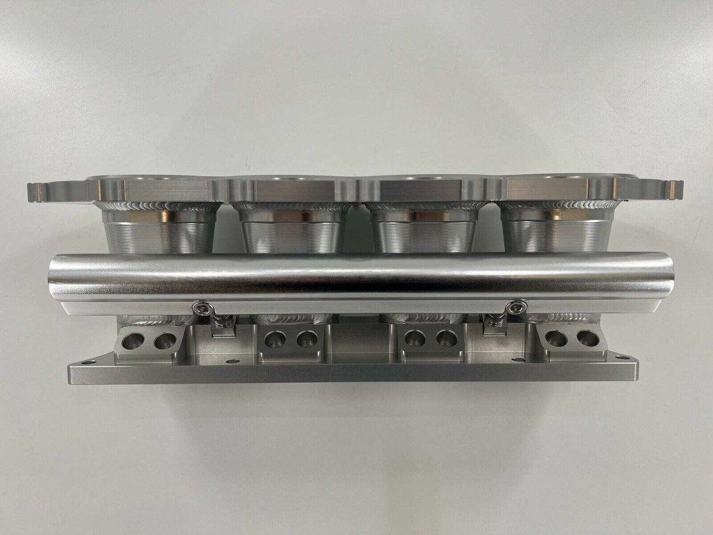 Jack Spania Racing billet K Series intake manifold adapter for Skunk2 Ultra engine parts, machined aluminum with precision fit.
