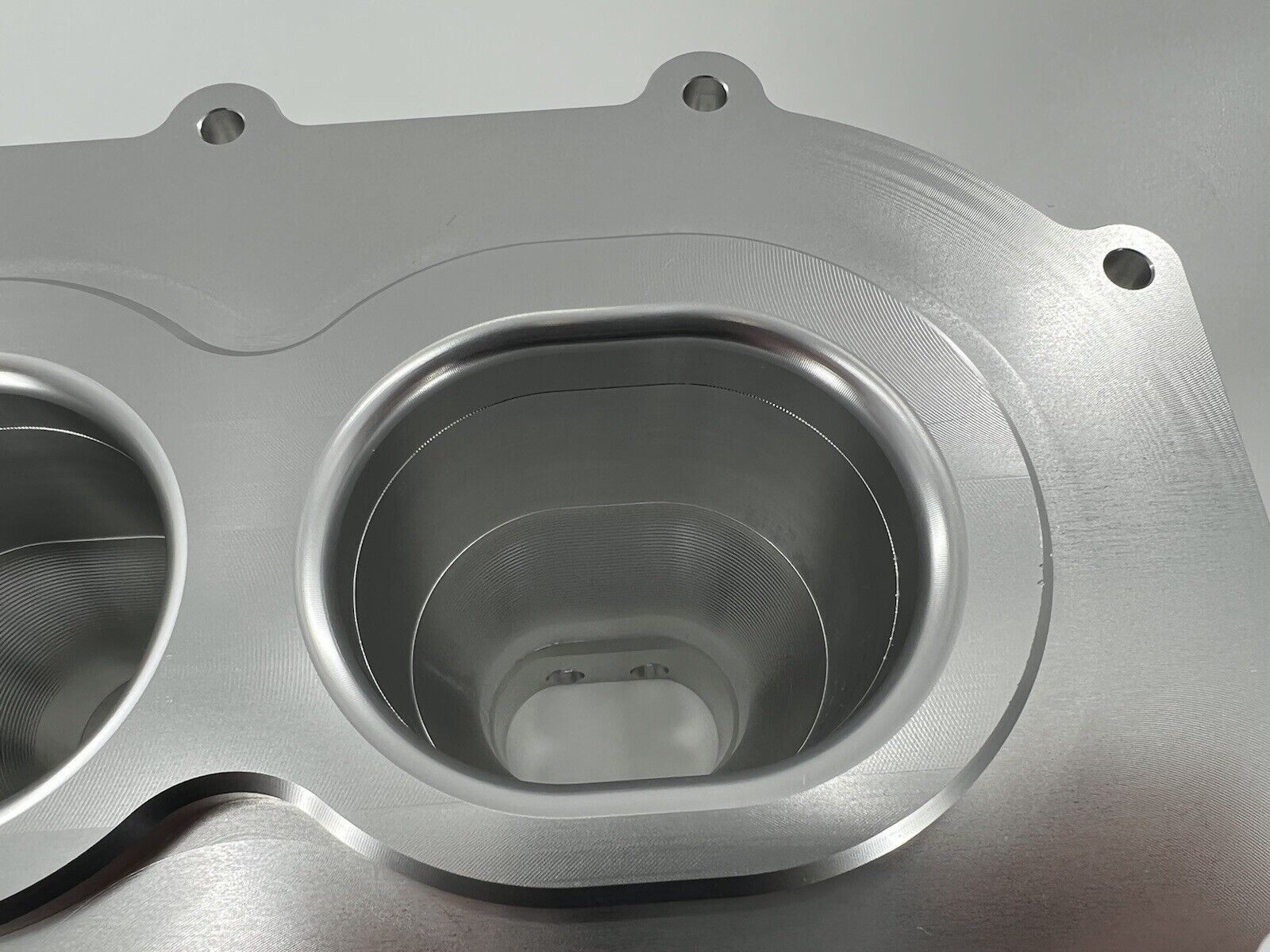 Jack Spania Racing billet K series intake manifold adapter for Skunk2 Ultra engine parts, shown installed on a vehicle engine.