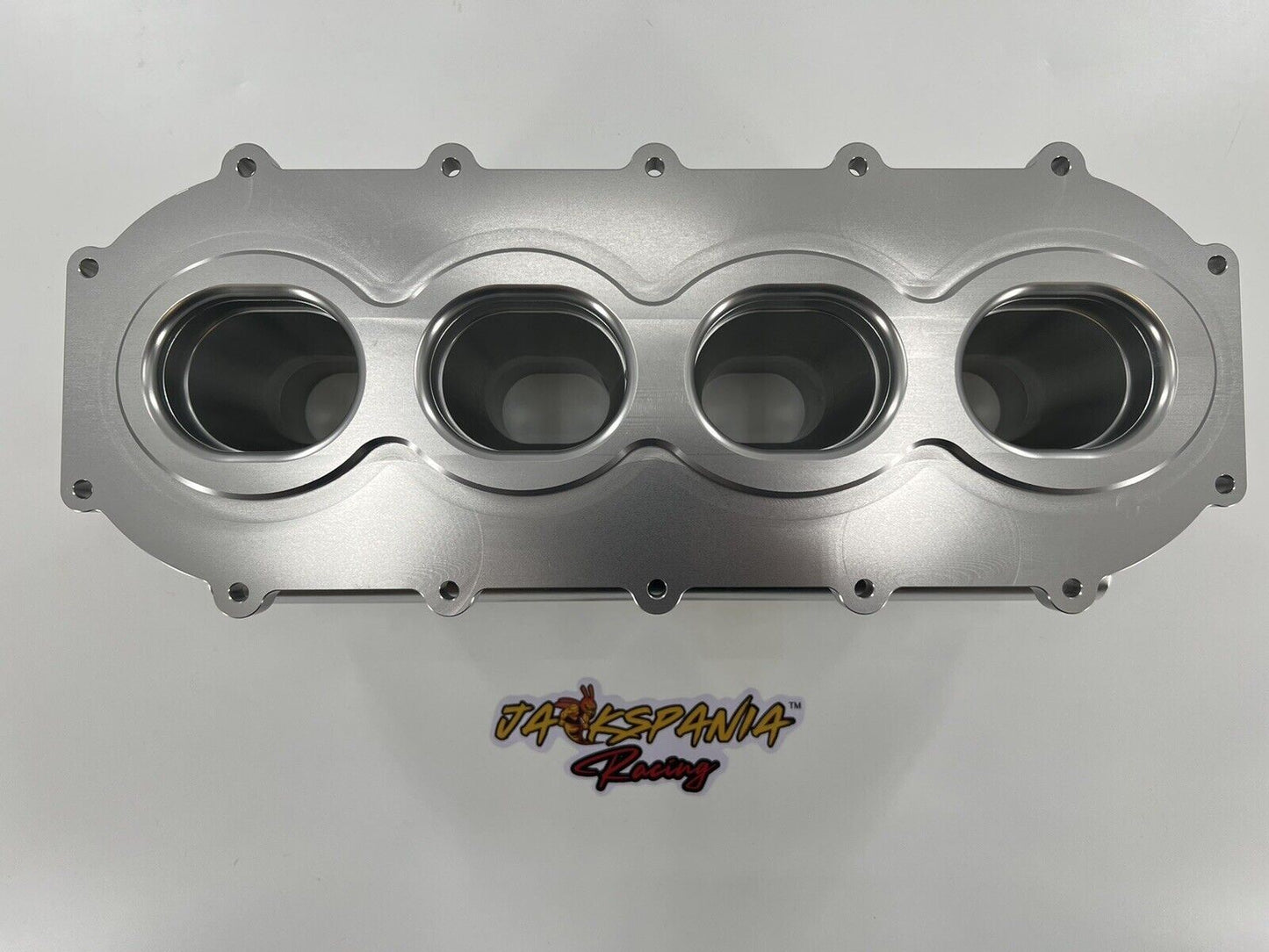 Jack Spania Racing billet K series intake manifold adapter for Skunk2 Ultra engine parts, showing precise machined metal finish.